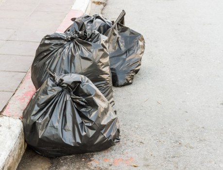 Photograph showing clearance workers sorting items for removal