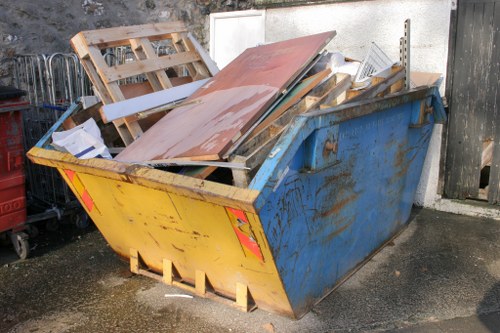Workers loading furniture into a van during a flat clearance in Blackwall